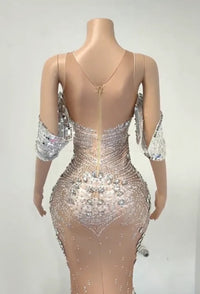 the back of a dress with sequins on it