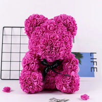 a teddy bear made out of pink roses