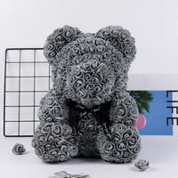 a teddy bear made out of rolled up roses