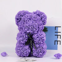 a purple teddy bear made out of flowers