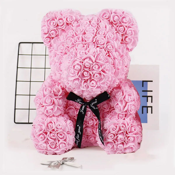 a pink teddy bear made out of pink roses