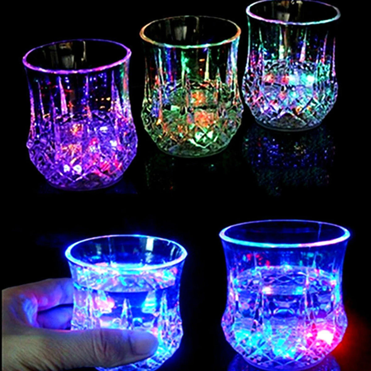a hand is holding a lit up glass