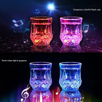 three different colored glass vases with music notes on them