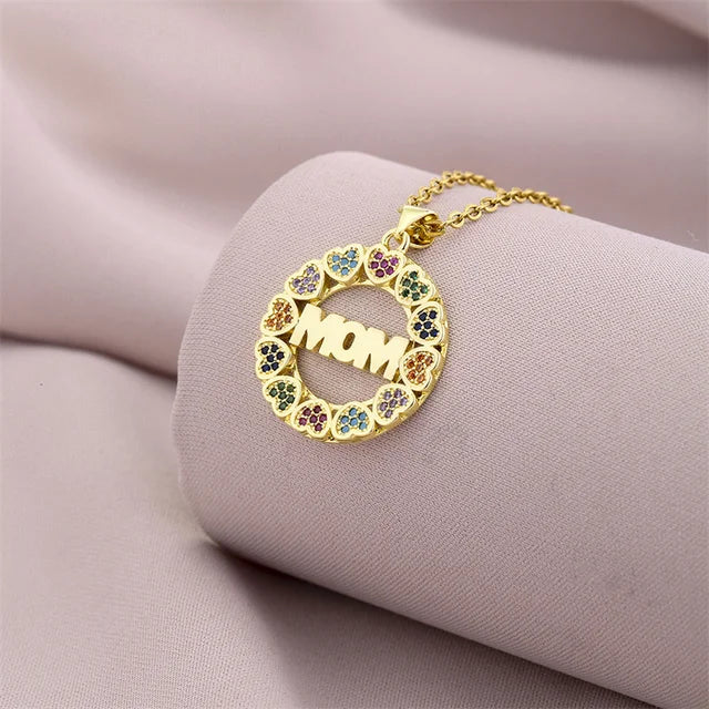 a mother's necklace with a flower design on it