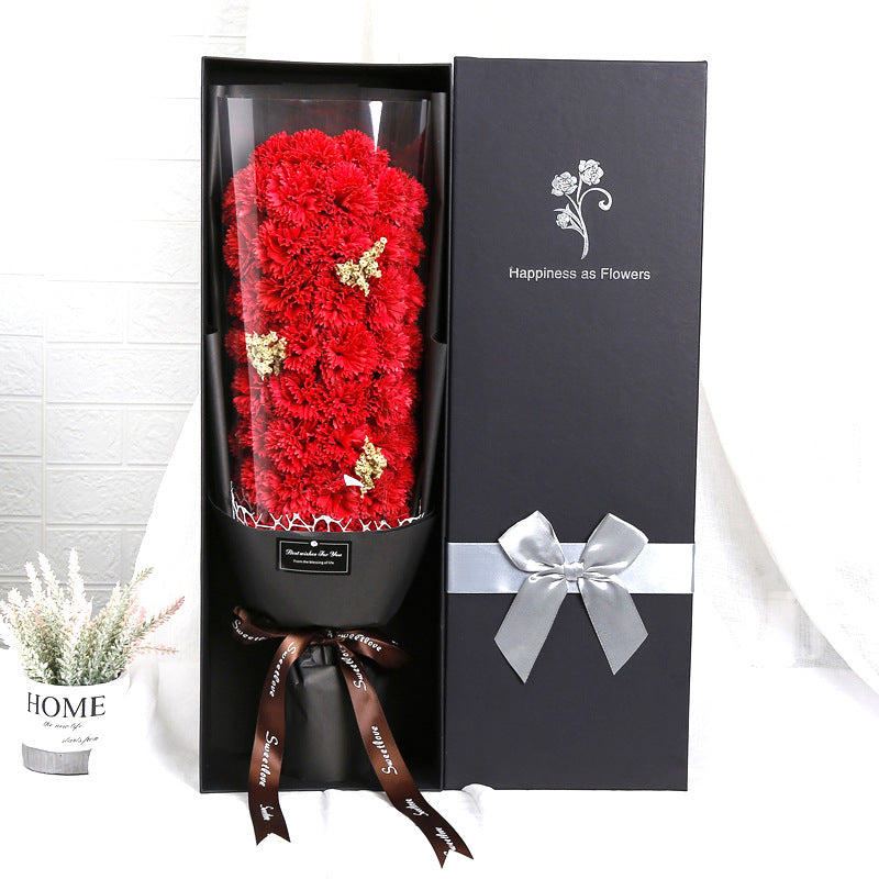 a black box with red flowers inside of it