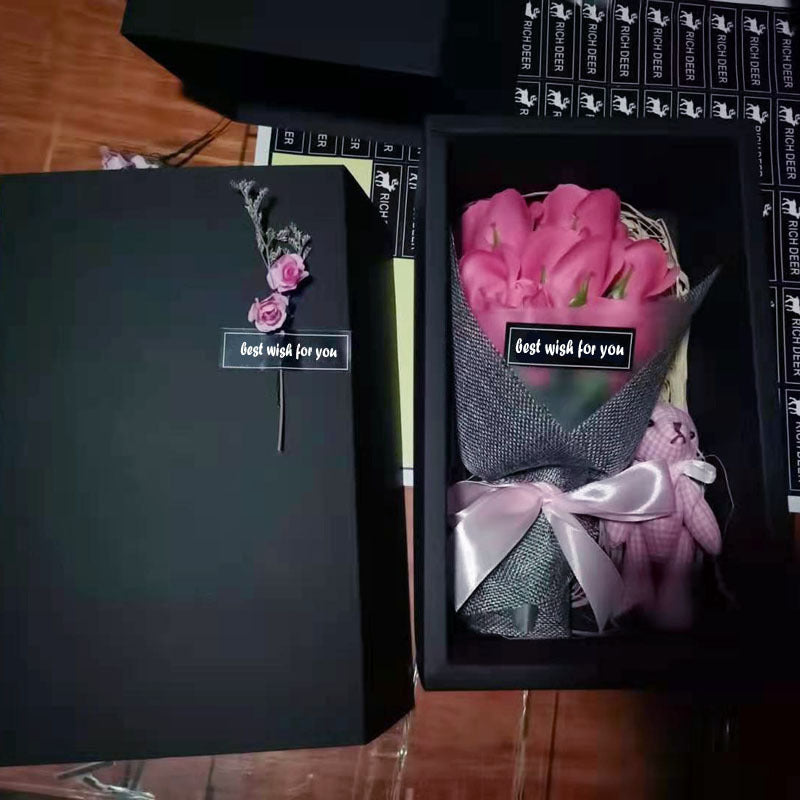 a couple of black boxes with pink flowers in them