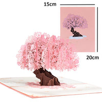 a card with a pink tree on it