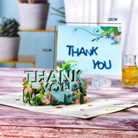 a thank you card sitting on top of a table