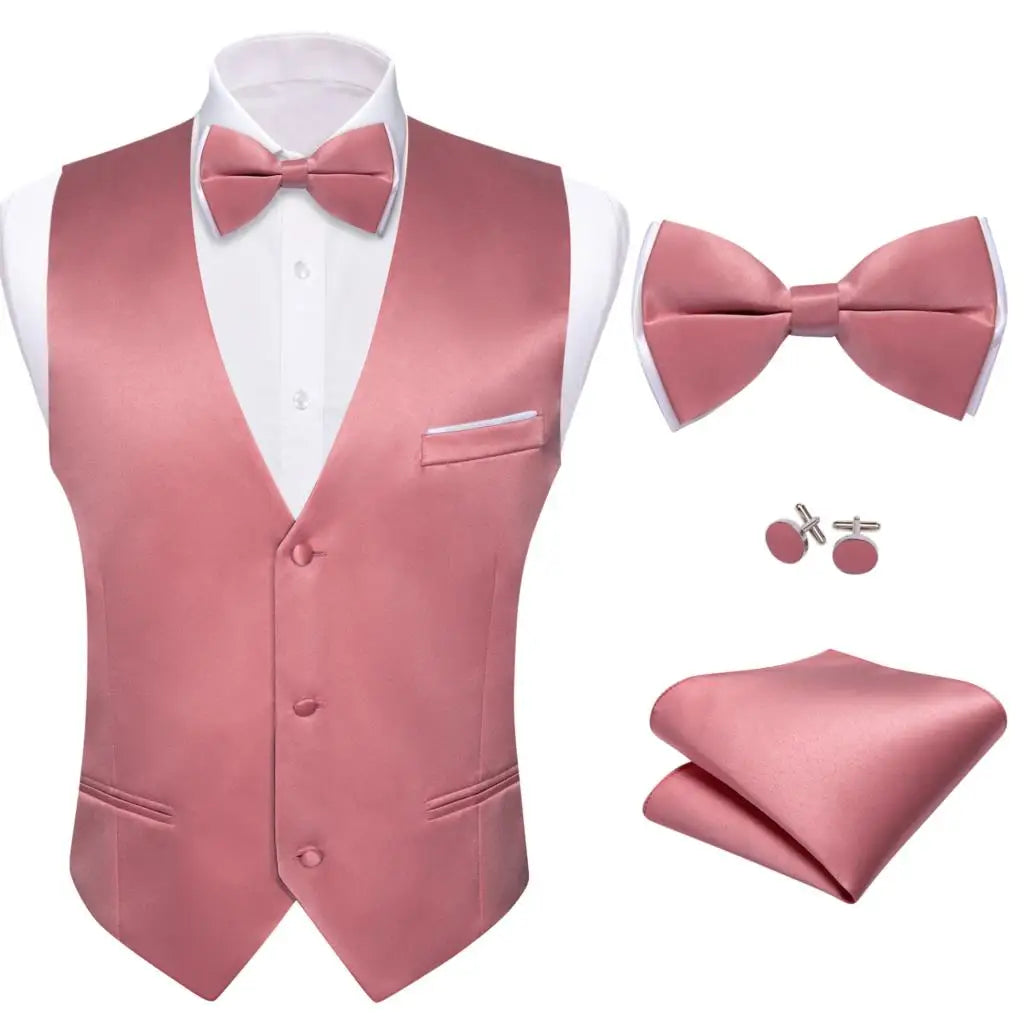 a man wearing a pink suit and bow tie