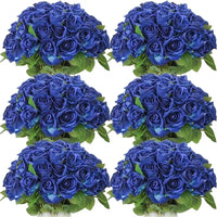 a bunch of blue roses in a vase