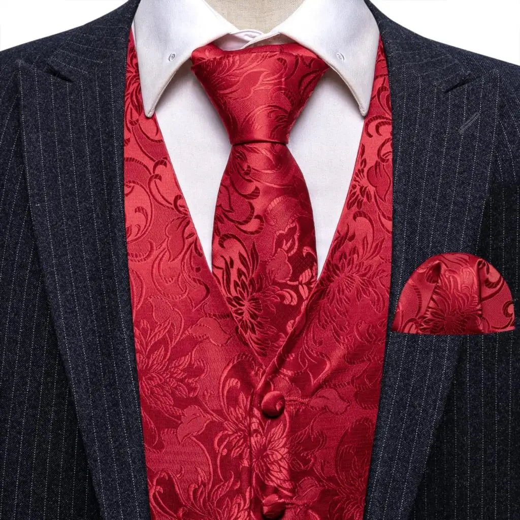 a man in a suit with a red tie and pocket square