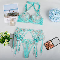 Seductive floral lingerie garter belt set in teal, featuring an elegant bra and adjustable garter belt. Lingerie NZ.