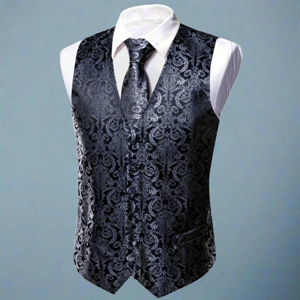 a black vest with a white shirt and tie
