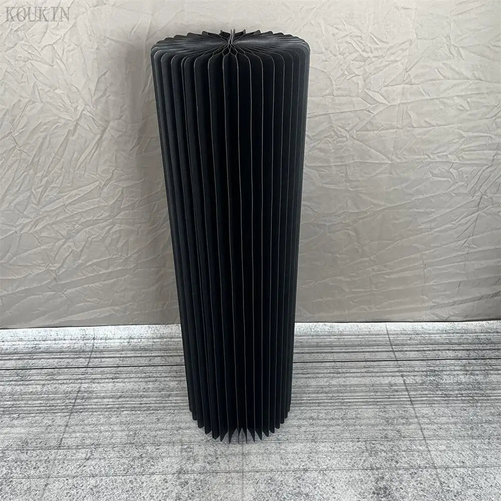 a tall black radiator sitting on top of a floor