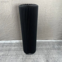 a tall black radiator sitting on top of a floor