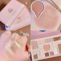 a person holding a pink and white box of makeup