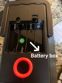 a battery box with four batteries in it