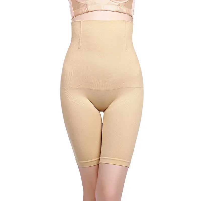 a woman wearing a beige bodysuit and panties