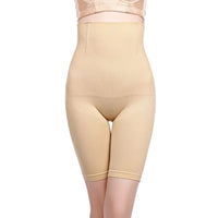 a woman wearing a beige bodysuit and panties