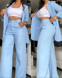 a woman in a white top and blue pants