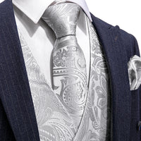 a close up of a suit with a tie and pocket square