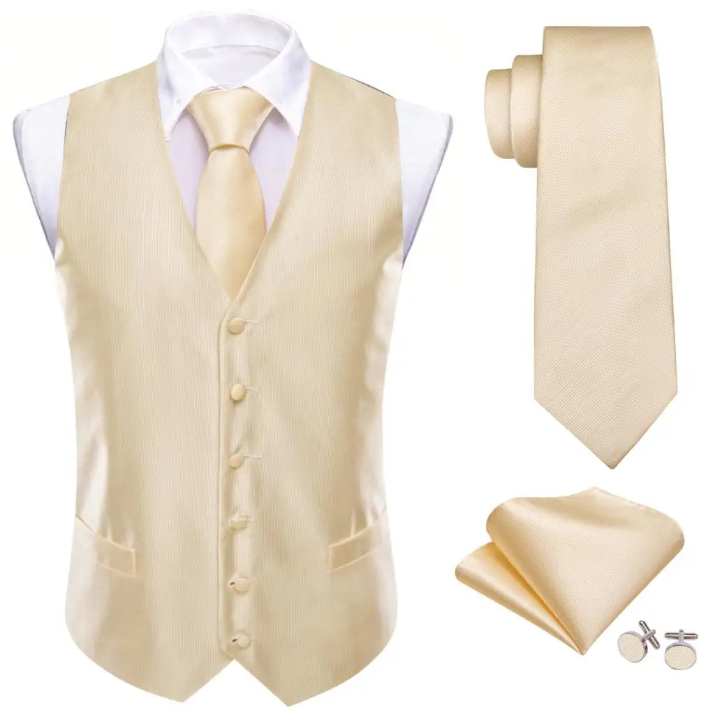 a suit and tie with a white shirt and gold tie
