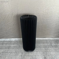 a large black radiator sitting on top of a floor