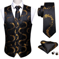 a black vest and tie with gold swirls on it
