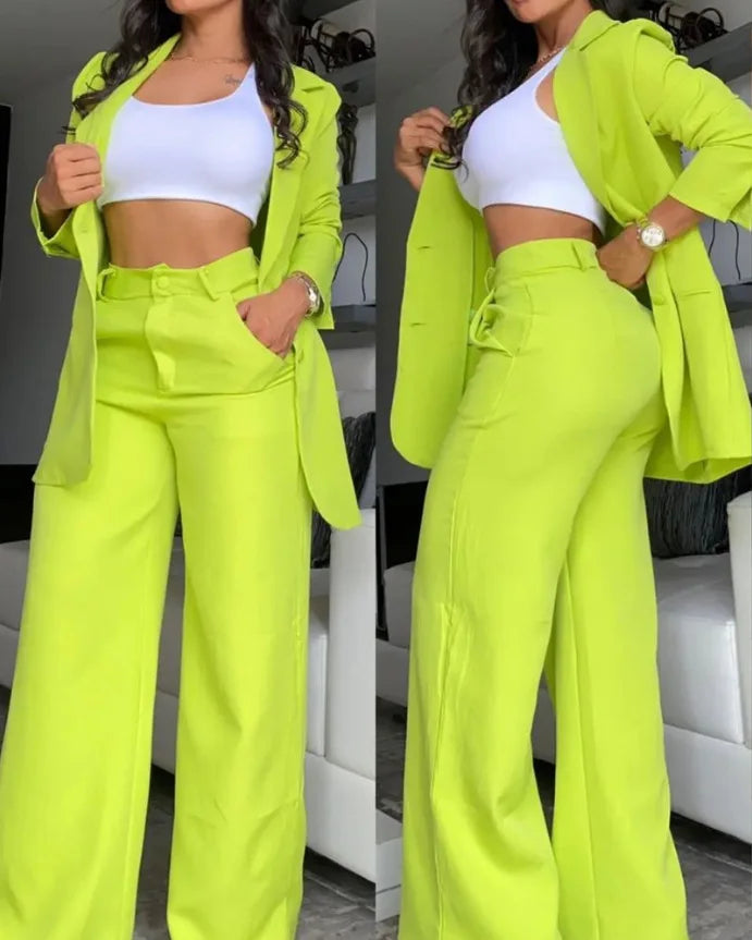 a woman wearing neon green pants and a white top