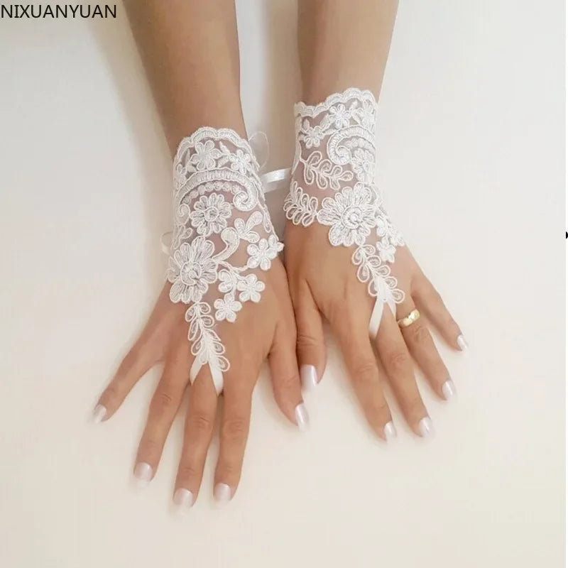 a woman's hands with white lace on them