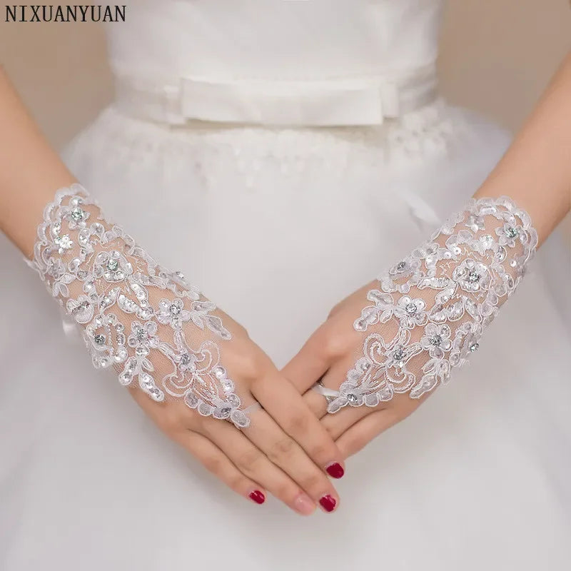 a close up of a person wearing wedding gloves