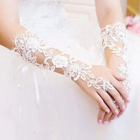 a close up of a person wearing a wedding glove