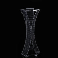 a glass vase with a curved design on it