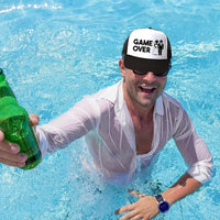 a man holding a beer bottle in a pool