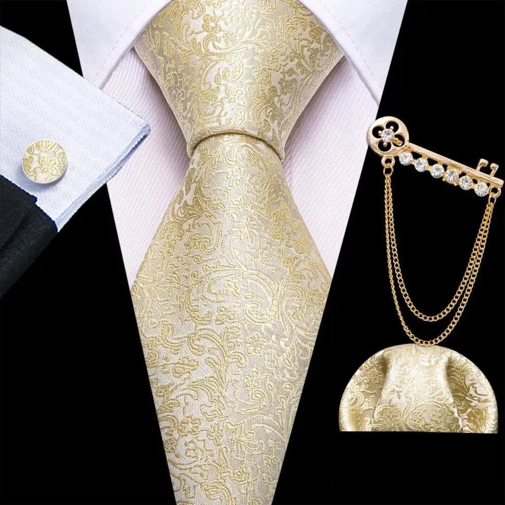 a man wearing a gold tie and a white shirt