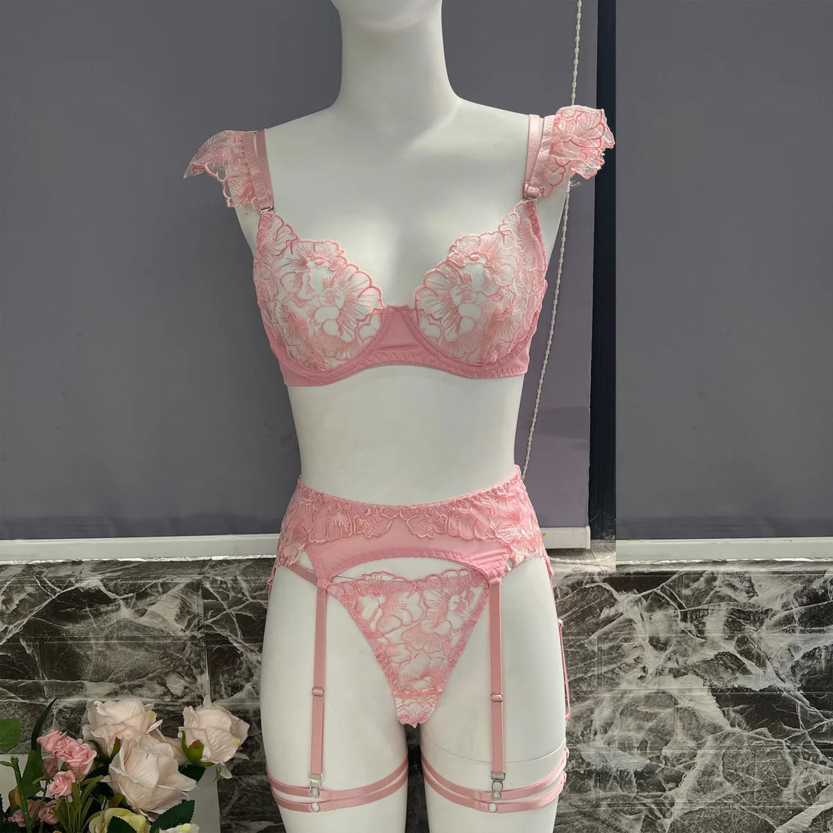 Pink lace bra and garter set for women with ruffle straps, perfect for confident, affordable lingerie in NZ.