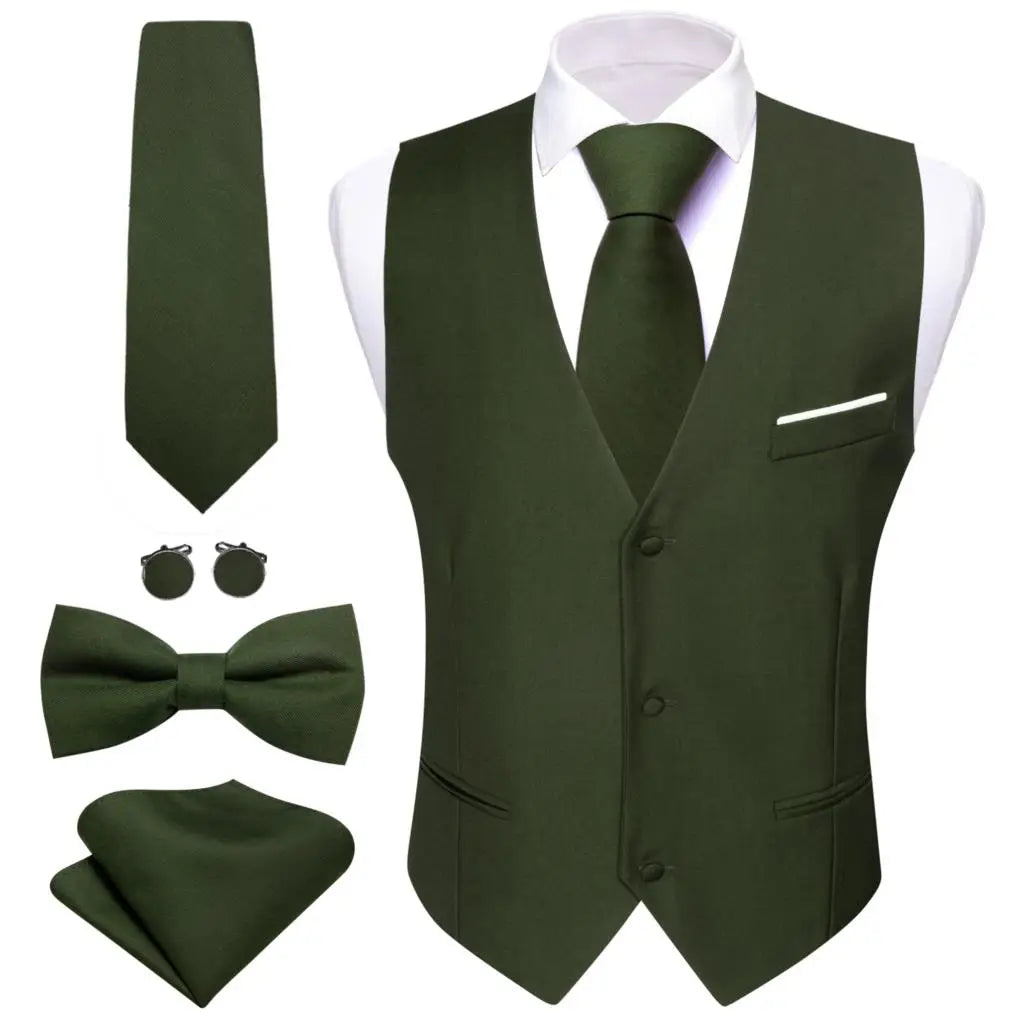 a green suit and tie with matching accessories