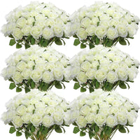 a bunch of white roses in a vase