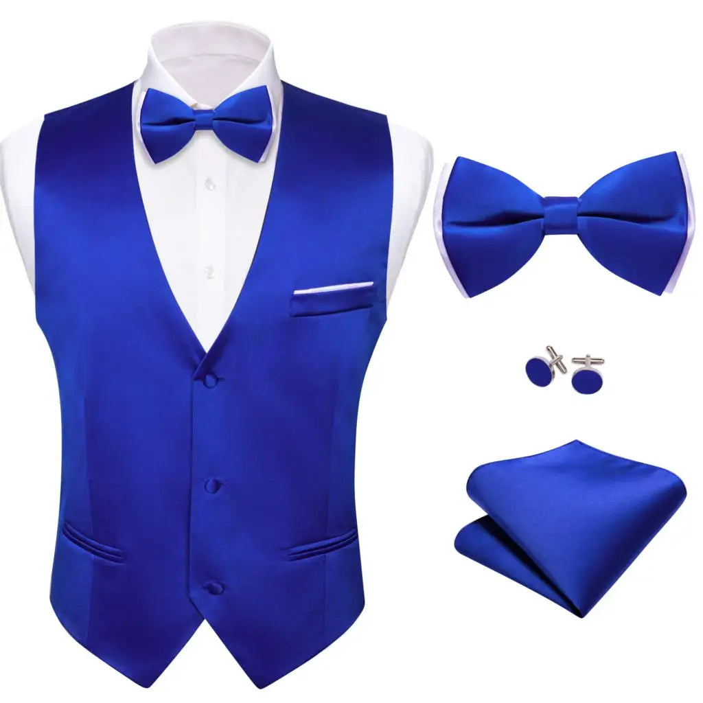 a blue suit with a bow tie and cufflinks