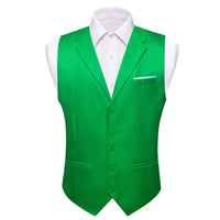 a green vest and white shirt on a mannequin