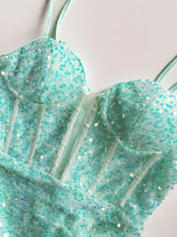 a close up of a dress with sequins on it