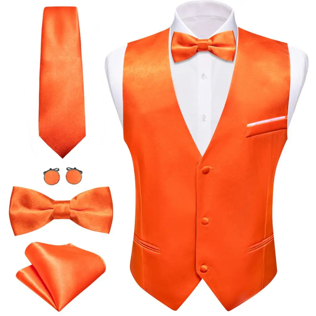 an orange vest, tie, and cufflinks on a mannequin
