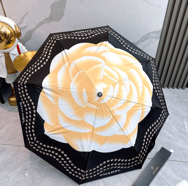 Elegant black printed umbrella with white rose design, perfect for stylish weather protection.