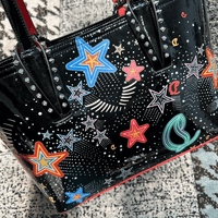 Celestial Edge Handbag featuring colorful star designs and metallic studs, ideal for luxurious weddings.