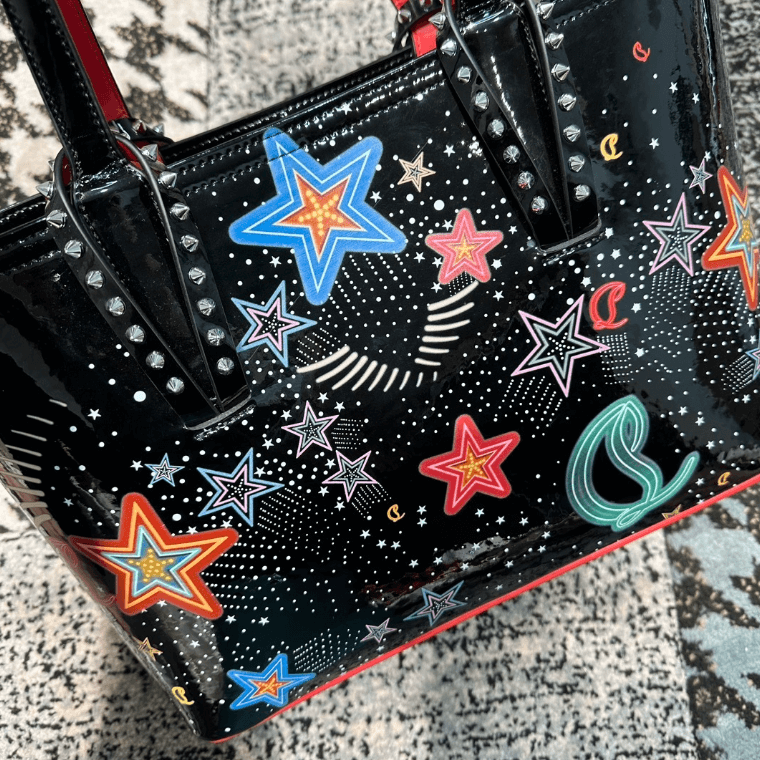 Celestial Edge Handbag featuring colorful star designs and metallic studs, ideal for luxurious weddings.
