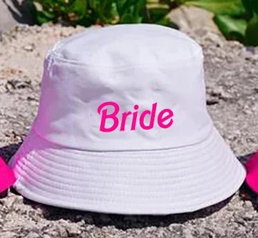 Hot pink 'Bride' bucket hat perfect for bachelorette parties and celebrations of love and friendship.