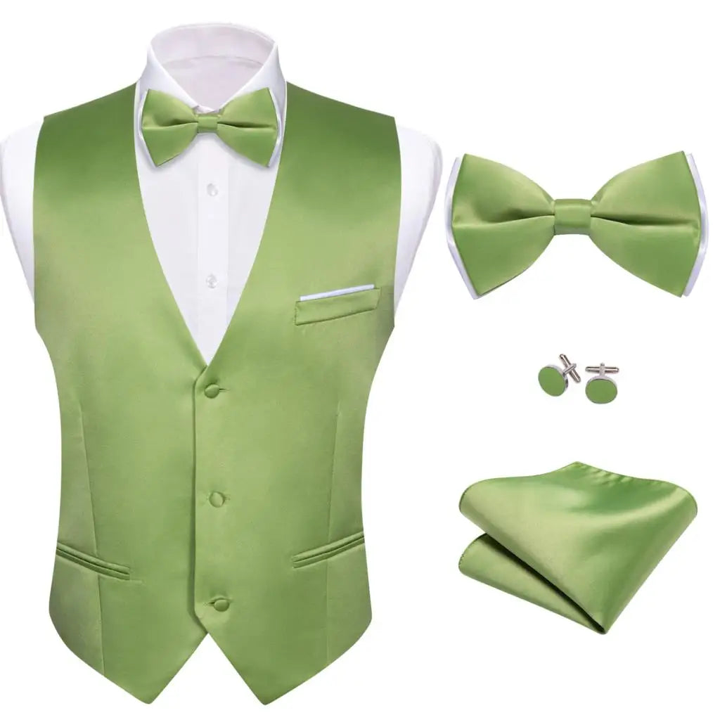 a man wearing a green vest and bow tie