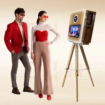 a man and a woman standing in front of a tv