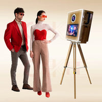 a woman standing next to a man in front of a tv