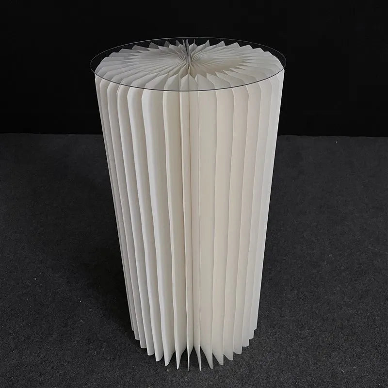 a large white vase sitting on top of a table